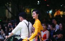 Đông Nhi mặc áo dài hát 