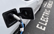 Global EV sales hit record 2.1 million in September, research firm says