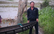 Villagers use duck-herding boats to save dozens from raging floodwaters in south-central Vietnam