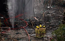 Police comb fire-ravaged Hong Kong apartments, death toll at 146