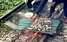 In Vietnam, couple fined for cooking on railway tracks