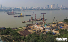 Hundreds of workers, engineers speed up work on $608mn iconic bridge project in Hanoi