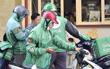 In Ho Chi Minh City, ride-hailing drivers struggle despite fuel support 