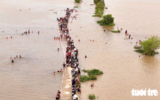 Floating season turns fields in Vietnam’s Mekong Delta into swimming destination