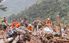 Indonesian rescuers halt evacuation due to bad weather after landslide kills 25, official says