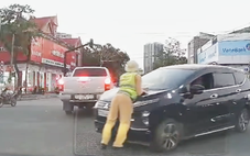Thiếu tá cảnh sát giao thông bị hất lên nắp capô giờ tan tầm