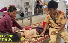 Bé gái bị co giật được cảnh sát giao thông dùng xe tuần tra chở đến bệnh viện cấp cứu