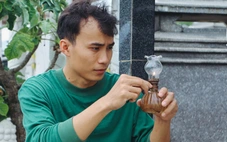 Nổi tiếng nhờ đốt đèn, trông mộ ở nghĩa trang