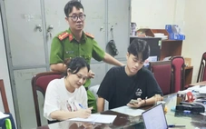 Cảnh sát dẫn giải Ngô Thị Thêu - vợ của Mr Hunter Lê Khắc Ngọ từ Thái Lan về Việt Nam