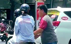 Đưa tài xế xe công nghệ rút chìa khóa xe máy của cô gái ở hồ Con Rùa về trụ sở làm việc