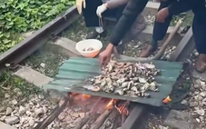 Xử phạt cặp vợ chồng nướng đồ ăn trên đường ray, con gái quay clip đăng TikTok