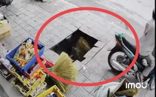 Giăng dây cảnh báo tại hố sụt khiến người đàn ông suýt rơi xuống cống