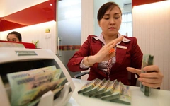 Tin tức sáng 3-12: Lãi suất liên ngân hàng qua đêm lên 7%