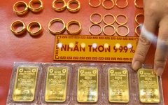 Giá vàng, bạc hạ nhiệt do áp lực chốt lời