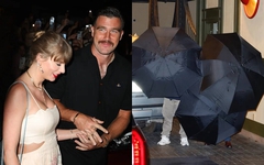 Taylor Swift và chồng sắp cưới che dù kín mít, bí mật đi chốt nhẫn cưới?