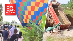 Bản tin 30s Nóng: Khinh khí cầu hạ cánh khẩn ở Hà Nội; Vỡ đê hồ Động Đình, chôn nhiều xe tải để bịt