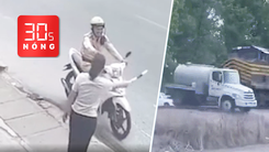 Bản tin 30s nóng: Clip cô gái trả gậy chỉ huy giao thông gây sốt; Đoàn tàu tông bay xe bồn tại Mỹ