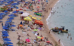 Spaniards struggle to enjoy their own beaches in tourist deluge