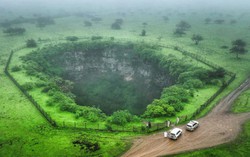 Mind the gap: tourists drawn to Oman's giant sinkholes