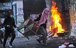 Indonesia police fire tear gas near campuses, riling rights groups