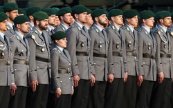 Germany works to clarify new rules on fighting-age men leaving country