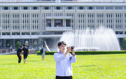 Who has to pay the $19 camera fee at Ho Chi Minh City's Independence Palace?