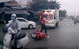 Cô gái nhanh chân nhảy khỏi xe máy sau va chạm giao thông