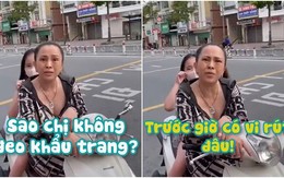 Người phụ nữ không đeo khẩu trang lý sự với cảnh sát giao thông