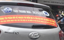 Hà Nội yêu cầu gỡ các biểu ngữ trên taxi