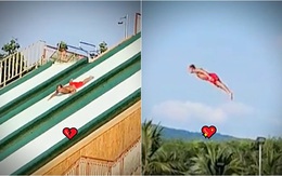 Người đàn ông chơi cầu tuột xuống bể bơi kiểu 'nàng tiên cá'