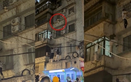 Thanh niên leo 4 tầng để giải cứu bé trai mắc kẹt 'chuồng cọp'