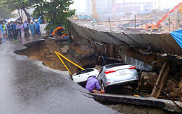 'Hố tử thần' nuốt 2 ô tô, đường nứt toác: Ai bồi thường?