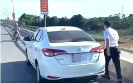 Dừng ô tô trên cầu ném đồ xuống sông, bị phạt 13,5 triệu đồng
