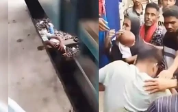 Người cha dũng cảm lao xuống đường ray cứu con thoát chết trong gang tấc khi đoàn tàu chạy qua