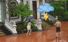 Chụp ảnh dưới trời mưa, hai vợ chồng bất ngờ được chèn 'hiệu ứng' đặc biệt