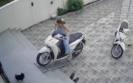 Cô gái ngã sõng soài khi lùi xe SH xuống sân