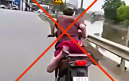 Xử phạt thanh niên nằm trên yên xe 'làm xiếc' trên đường