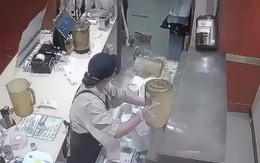Cô gái đứng hình vì tủ pha chế bỗng dưng bị ngã