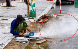 Làm vỉa hè, cắt đá granite dưới lòng đường, người dân hứng đủ khói bụi
