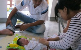 Em bé đa dị tật đã hồi phục