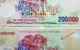 Làm gì khi rút phải tiền giả ở ngân hàng?