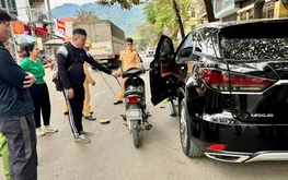 Driver indicted after opening car door causes crash killing boy in northern Vietnam