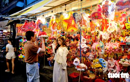 Ho Chi Minh City lantern streets bustle as vendors struggle to attract buyers