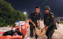 Locals, soldiers, police work through night to reinforce dikes in northern Vietnam
