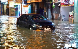 Chaos in Ho Chi Minh City as sudden deluge and rising tides leave commuters stranded