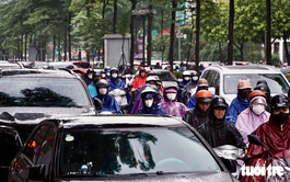 Flooded streets, gridlocked traffic leave Hanoi commuters stranded for hours