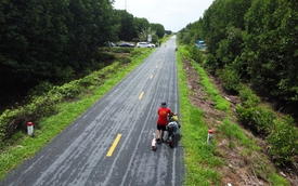 A man and his goose walk across Vietnam