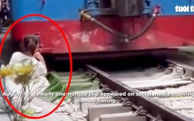 Train knocks phone away from woman at Hanoi's train street