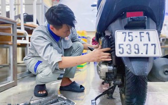Vietnamese students repair flood-damaged motorbikes for free as central region recovers