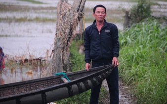 Villagers use duck-herding boats to save dozens from raging floodwaters in south-central Vietnam